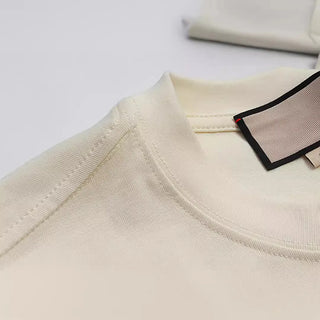 2025 Early Spring New GU Home Dissolved Melted Letter Printed Men's and Women's Short sleeved T-shirt Top