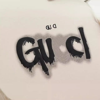 2025 Early Spring New GU Home Dissolved Melted Letter Printed Men's and Women's Short sleeved T-shirt Top